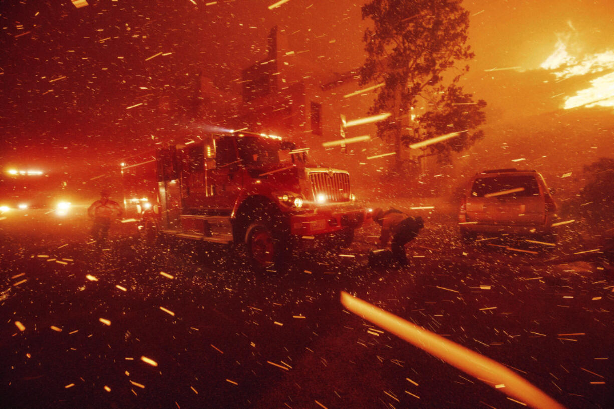 Firefighters battle the Franklin Fire in Malibu, Calif., on Tuesday, Dec. 10, 2024.