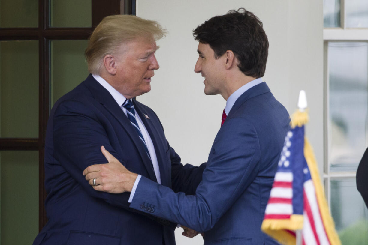 FILE - President Donald Trump greets Canadian Prime Minister Justin Trudeau upon his arrival at the White House, June 20, 2019, in Washington.