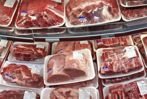 FILE - In this Nov. 2, 2013 file photo, various cuts of beef and pork are displayed for sale in the meat department at a discount market in Arlington, Va. (AP Photo/J.