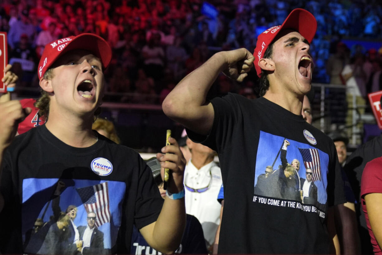 FILE - Supporters react as Republican presidential nominee former President Donald Trump arrives for a campaign rally, Oct. 21, 2024, in Greenville, N.C.