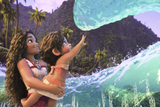 This image released by Disney shows the characters Moana, voiced by Auli&#039;i Cravalho, holding Simea, voiced by Khaleesi Lambert-Tsuda, in a scene from &quot;Moana 2.&quot; (Disney via AP)