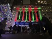 People gather in front of the New York Stock Exchange in New York&rsquo;s Financial District on Tuesday, Dec. 10, 2024.