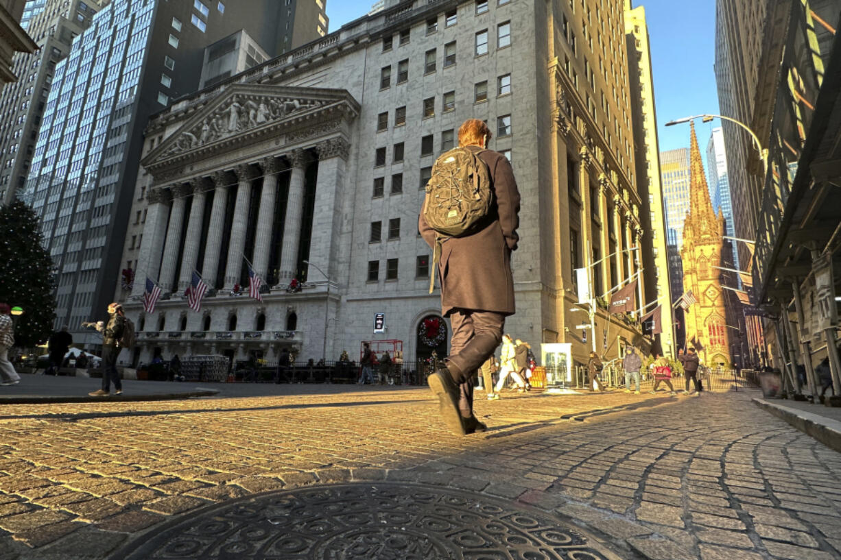 A person walks on Wall St. near the New York Stock Exchange in New York&rsquo;s Financial District on Wednesday, Dec. 4, 2024.