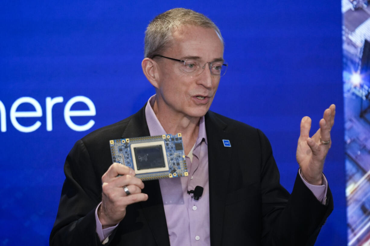 FILE - Intel CEO Pat Gelsinger speaks while holding a new chip, called Gaudi 3, during an event called AI Everywhere in New York, on Dec. 14, 2023.