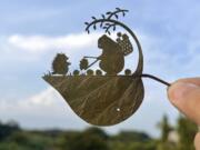 Japanese leaf-cutting artist, who goes by the name Lito, shows his work titled: &ldquo;Wait a second!