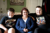 Melissa Dodge, center, sits with her sons Lucas, left, and Dylan at their home in Vancouver in May. Dodge has launched a new nonprofit, Pacific Northwest Family Navigation.