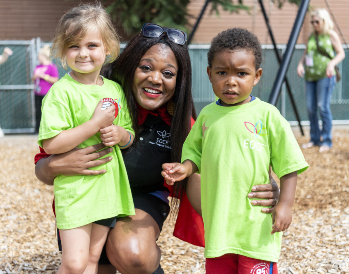 Educational Opportunities for Children and Families CEO Rekah Strong poses for a photo with students Maycee Hawn, left, and Jameson Owens during a field day at Educational Opportunities for Children and Families on MacArthur Boulevard in July 2023.