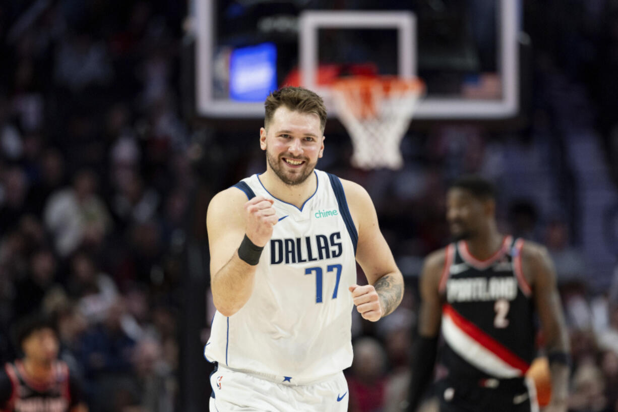 Dallas Mavericks guard Luka Doncic reacts to his teammate&rsquo;s made shot against the Trail Blazers.