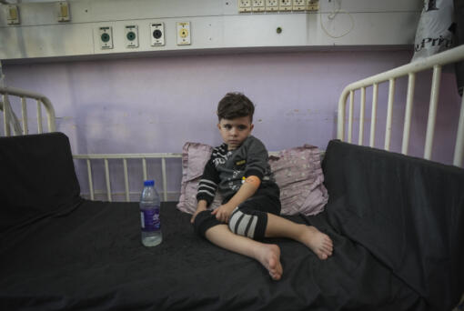 Qusay al-Askari, 4, sits in a bed in Deir al-Ballah, Gaza Strip, on Nov. 16, 2024. His mother Nima al-Askari said she was told by doctors that her son could become paralyzed if he doesn&rsquo;t get surgery in the next two or three months for a heart defect that constricts his aorta.