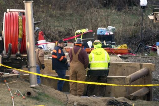 Rescue workers continue to search, Wednesday, Dec. 4, 2024, for Elizabeth Pollard, who is believed to have disappeared in a sinkhole while looking for her cat, in Marguerite, Pa. (AP Photo/Gene J.