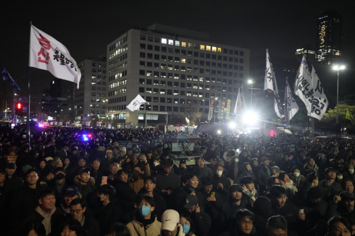 People gather in front of the National Assembly in Seoul, South Korea, Wednesday, Dec. 4, 2024.