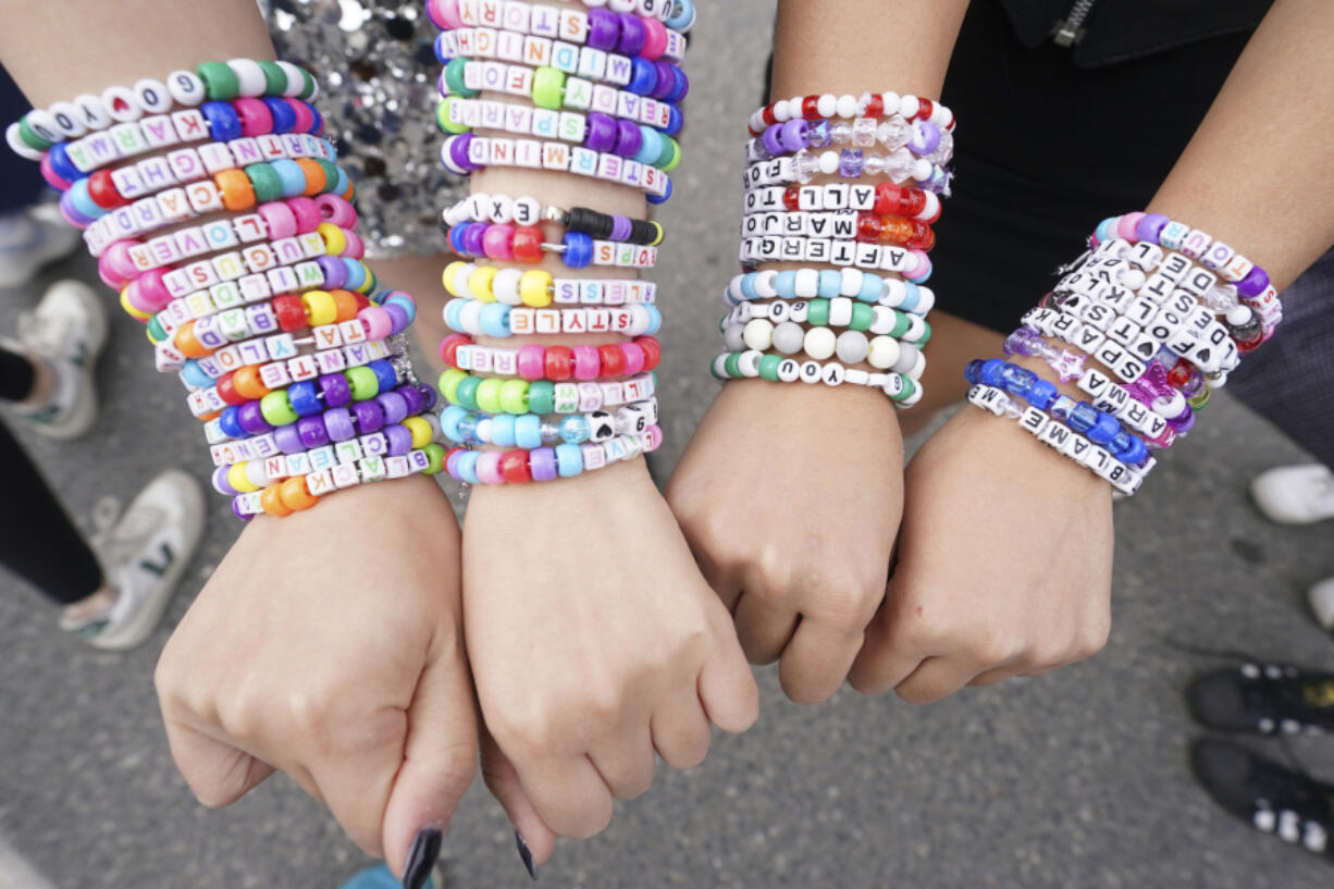 FILE - Taylor Swift fans display bracelets outside Toronto&rsquo;s Rogers Centre before going to see Taylor Swift perform on Nov. 14, 2024.