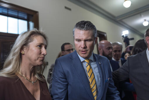 Pete Hegseth, President-elect Donald Trump&rsquo;s nominee to be defense secretary, is joined by his wife Jennifer Rauchet, left, as they arrive to meet with Sen. Ted Budd, R-N.C., a member of the Senate Armed Services Committee, at the Capitol in Washington, Tuesday, Dec. 3, 2024. (AP Photo/J.