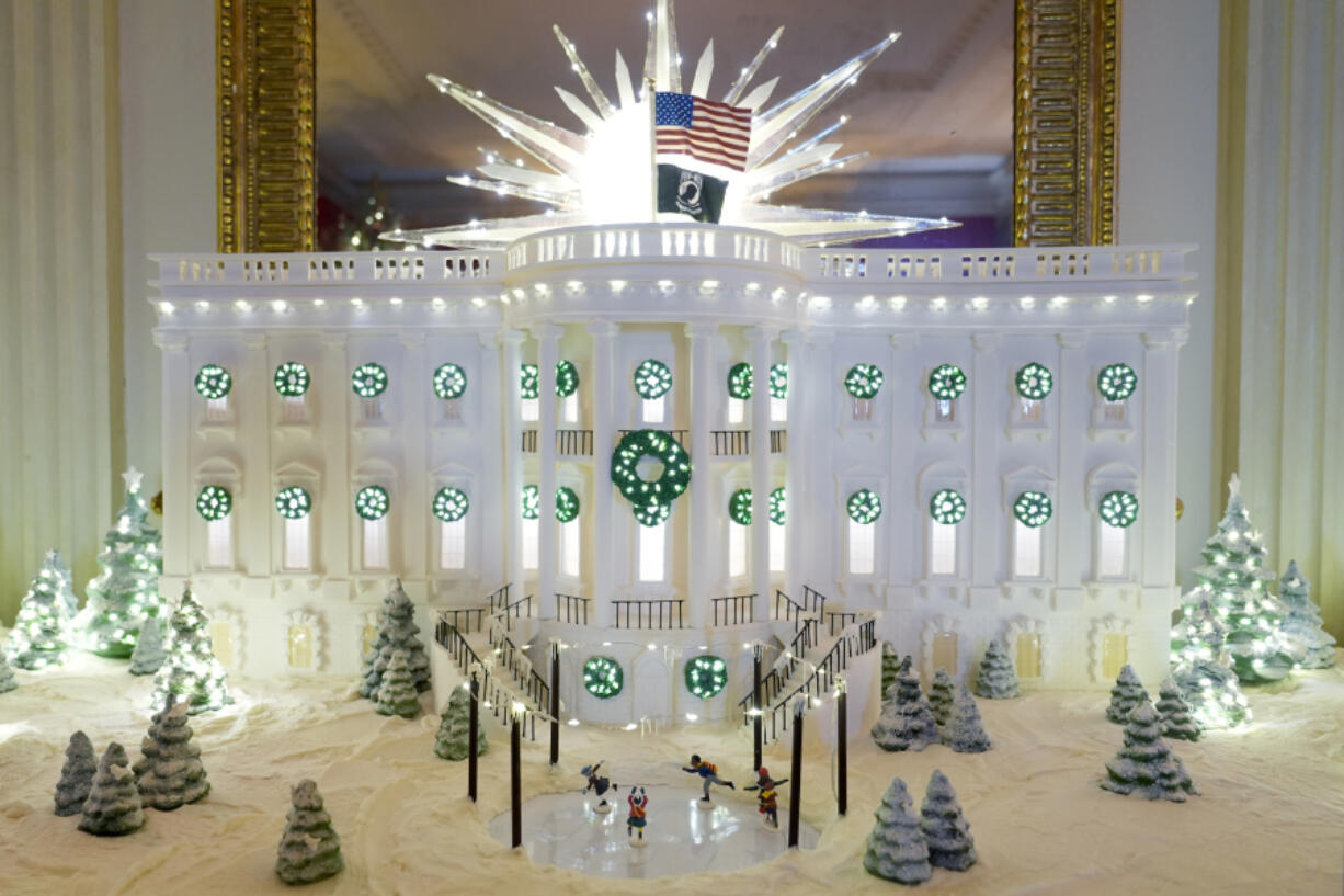 A gingerbread house is on display in the State Dining Room of the White House as part of holiday decorations, Monday, Dec. 2, 2024, in Washington.