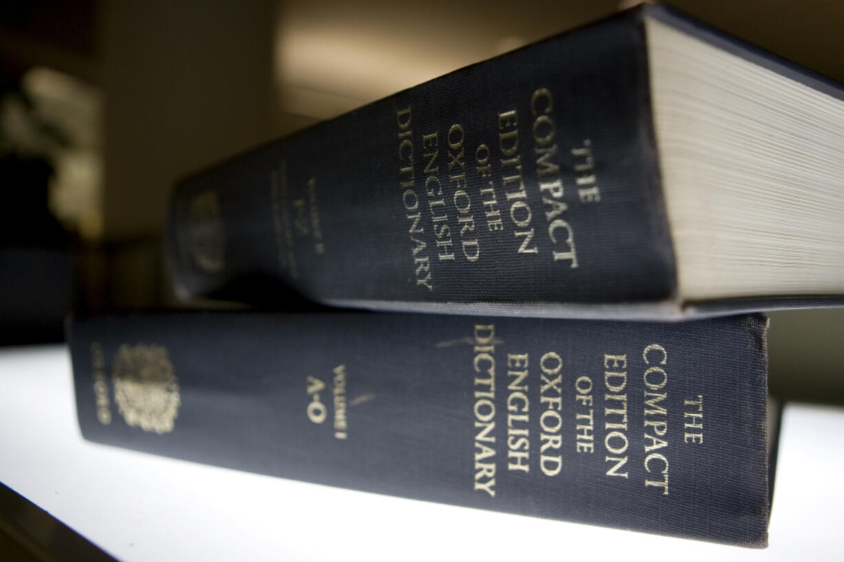 FILE- In this Aug. 29, 2010 file photo, an Oxford English Dictionary is shown at the headquarters of the Associated Press in New York.