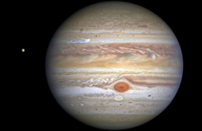 NASA
This Aug. 25, 2020 image captured by NASA&rsquo;s Hubble Space Telescope shows the planet Jupiter and one of its moons, Europa, at left, when the planet was 406 million miles from Earth. (, ESA, STScI, A. Simon, M. via AP)